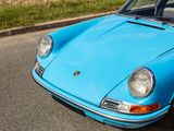 a blue car that is parked on the side of the road