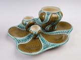 two cups and a saucer on a plate