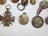 a lot of medals that are on a table