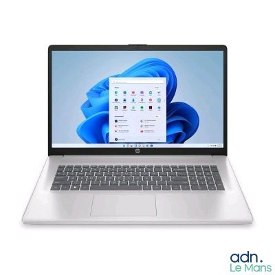 an open laptop computer sitting on top of a white surface