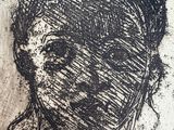 an ink drawing of a woman ' s face on a piece of paper