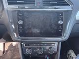 the interior of a car with a steering control and dashboard controls