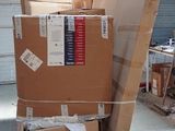 many boxes stacked on top of each other in a warehouse