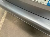 a close up of a car ' s bumper with a sticker on it