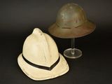 two hats sitting next to each other on a table