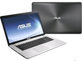 the asus laptop is next to a laptop with the asus logo on the screen