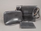 a black purse and a wallet on a table