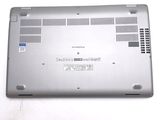 a laptop that is sitting on a white surface