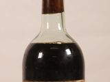 a bottle of wine that is sitting on a table
