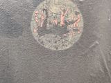 a black plate with a picture of a man and a woman on it