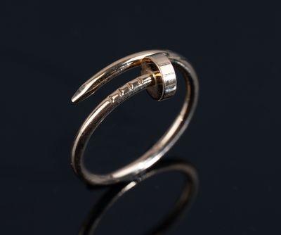 a close up of a silver ring on a black surface