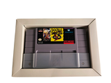 a box with a game inside of it on a white surface