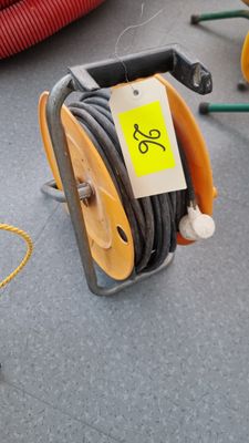 a hose that is sitting on the ground next to other hoses