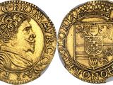 a gold coin with an image of a man on it