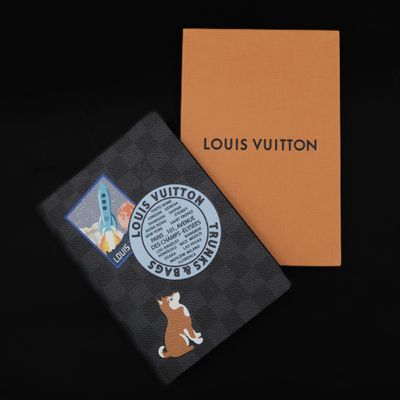 louis vuitton passport cover with a dog on it