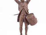 statue of a man with a drum and a drum stick
