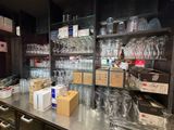 many glasses and boxes on the counter in the store