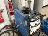 a blue machine that is sitting in the garage