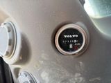 a close up of a car ' s dashboard with a volt gauge