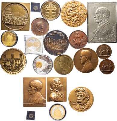 an image of a collection of old and new coins on a white surface