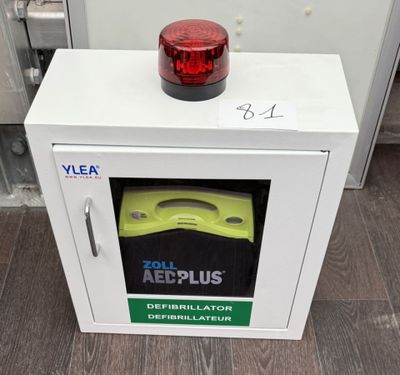 a white box with a red light on top of it