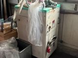 a machine that is sitting in the corner of a room