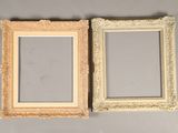pair of antique picture frames on a gray background