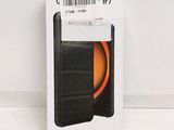 a box with a phone inside of it on a white surface