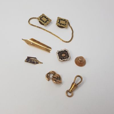 several different types of jewelry are displayed on a white surface