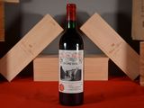 a bottle of wine that is sitting on a table