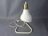 an image of a white lamp with a cord attached to it