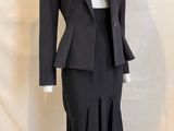 an image of a woman ' s suit and skirt on a mannequin