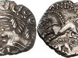 a silver coin with an image of a man on it