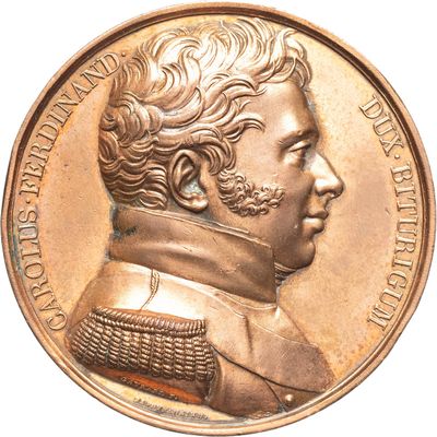 gros plan d'une médaille avec un visage d'homme dessus