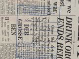 a close up of a newspaper with a lot of writing on it