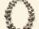 pearl and silver necklace on a white background