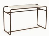 a white table with a metal frame and a glass top