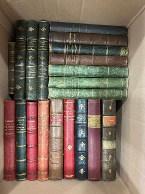many old books in a box on the shelf