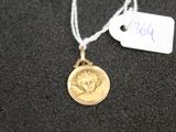 a gold coin with a picture of a woman on it
