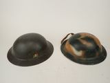 two helmets that are sitting on a table
