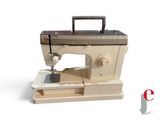 a sewing machine that is sitting on top of a table