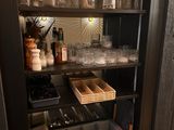 a cabinet that has a lot of items in it