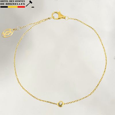 a gold bracelet with a diamond on a white background