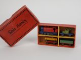 a red box with a toy train inside of it