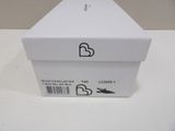a white box with a heart on it on a table
