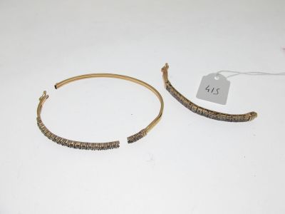 pair of gold tone hoop earrings with beaded details