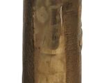 a gold vase that is sitting on a white surface