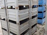 many crates stacked on top of each other in the dirt