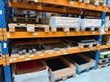 many shelves with various items on them in a warehouse