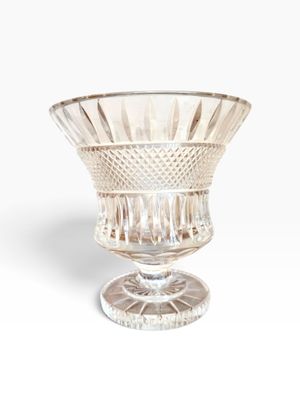 a glass bowl that is sitting on top of a table